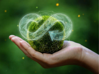 businessman holding circular economy icon Circular economy concept for future business growth and environmental sustainability and reduce pollution for future business and environmental growth.