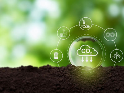 Reduction of carbon emissions, carbon neutral concept. Net zero greenhouse gas emissions target.Reducing carbon footprint concept.Decreasing CO2 emissions target symbol on green view background.