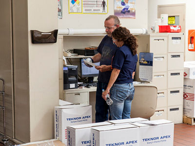 Teknor employees reviewing work