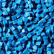 Close up of PVC pellets, blue square cut granules, elastomer blends