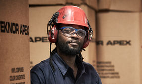 Teknor Apex Worker in Helm and Safety Glasses