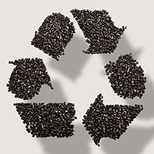 Recycling symbol made out of ETP pellets, recyclon ETPs on gray beige with drop shadow