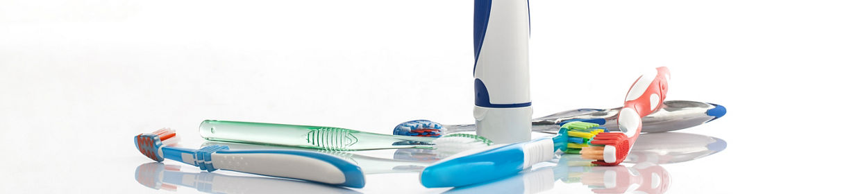 toothbrushes on white with reflection