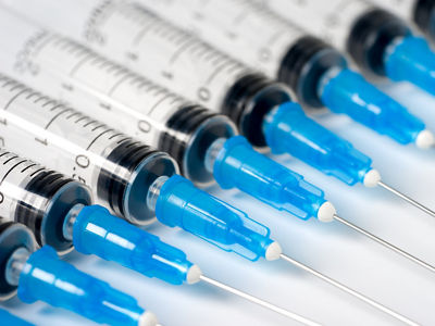 Disposable syringe on white background