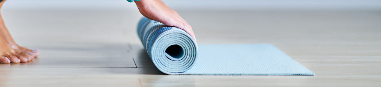 Picture of adult woman practising yoga at home