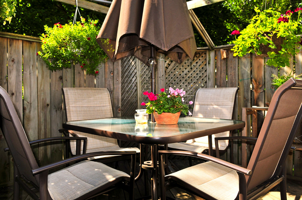 Wooden deck of a house with patio furniture